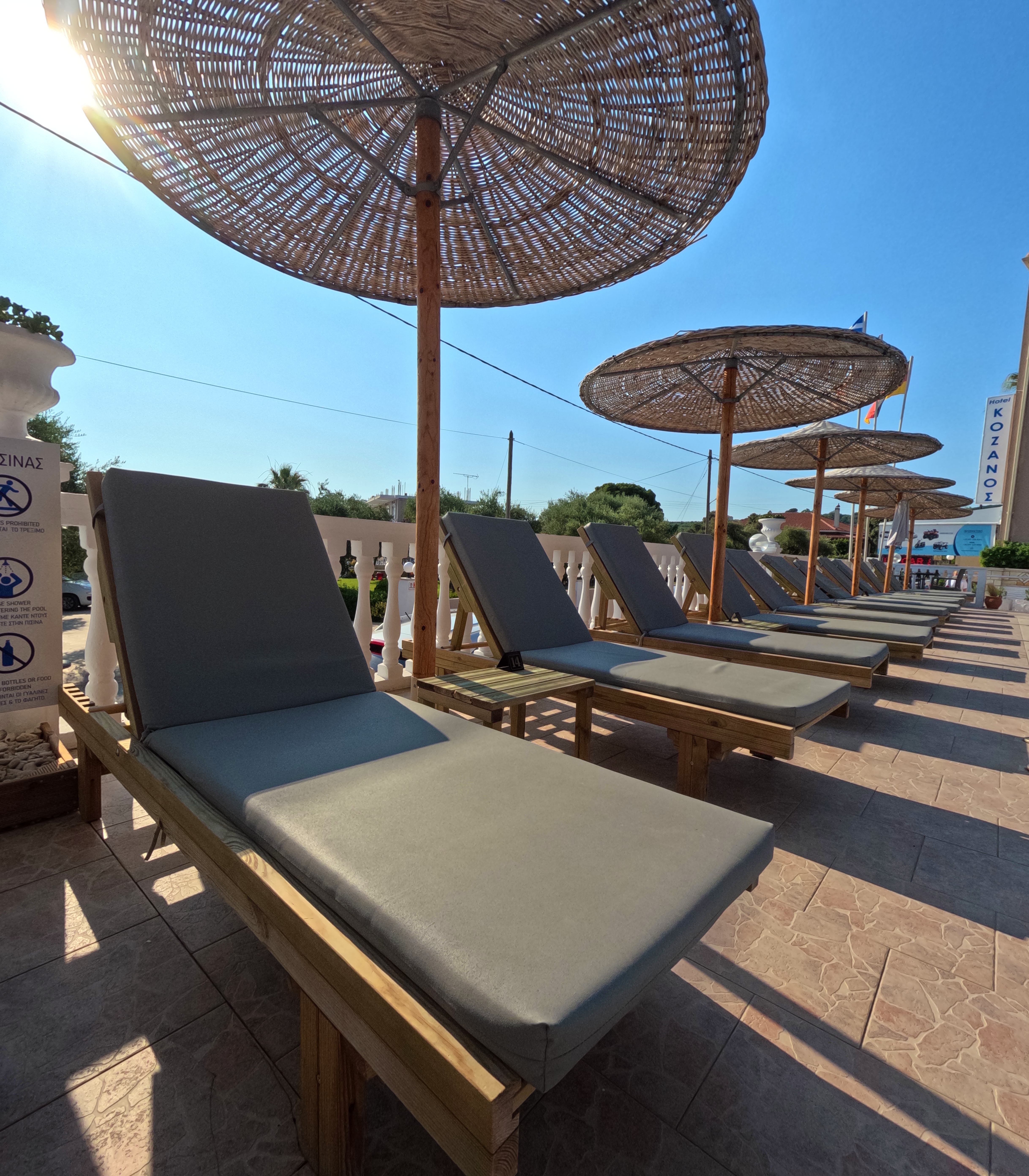 Kozano Suites poolside loungers